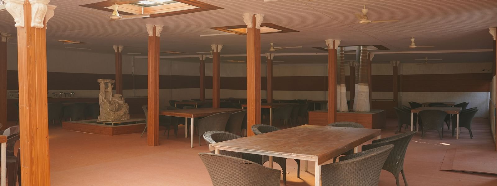 A dining seating area at The Meenakshi Resort by Welcome Inn Hospitality, Bangalore.