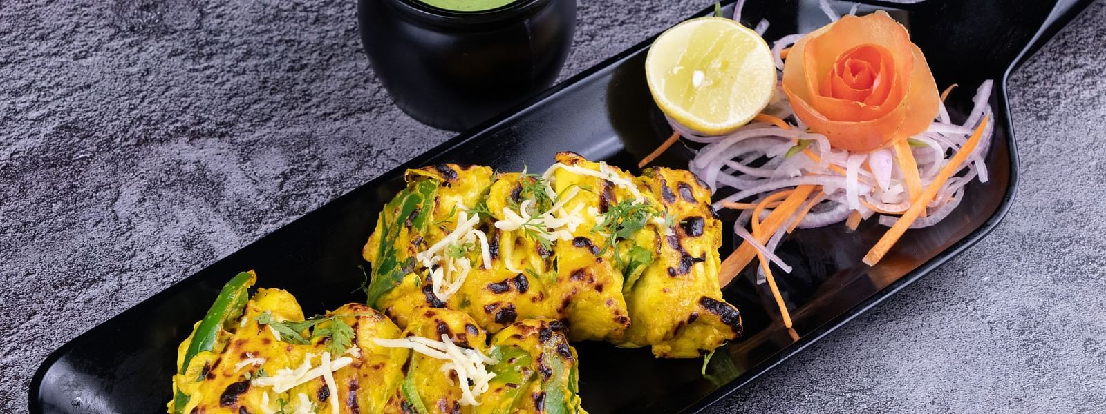 Grilled kebabs with colorful spices and a drizzle of cream, served with lemon and salad - The President Hotel, Kumara Park, Bangalore