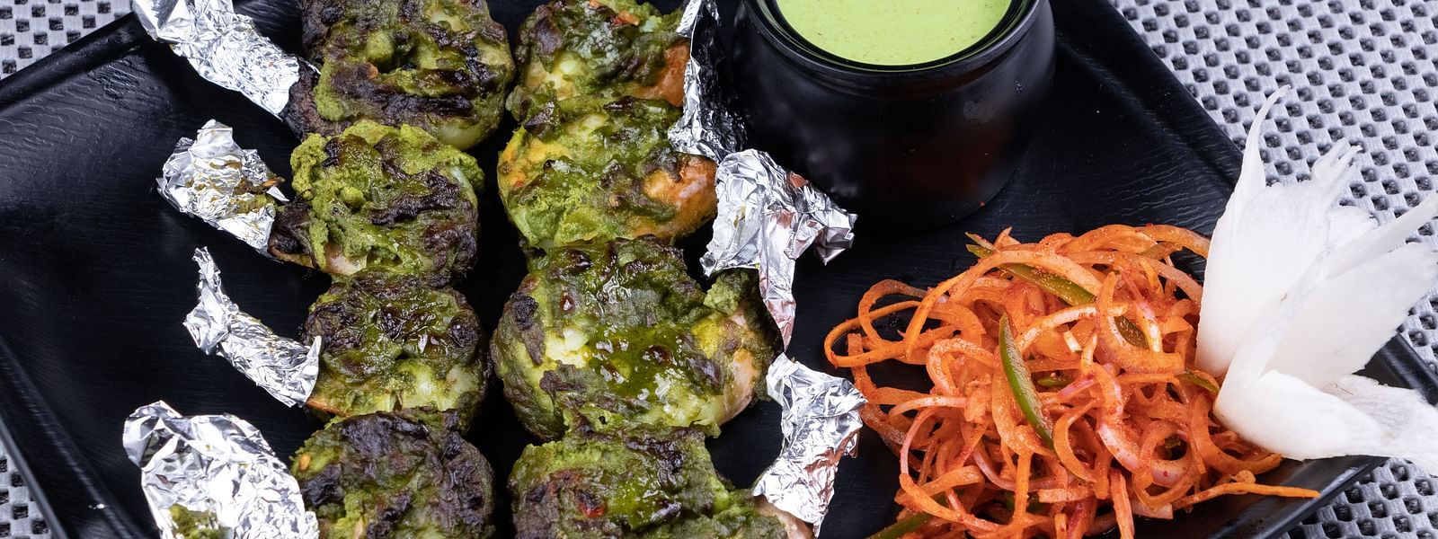 Green herb-marinated grilled chicken served with a mint dip and carrot salad - The President Hotel, Kumara Park, Bangalore