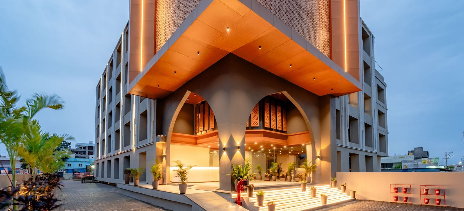 Close-up of the Pravasa Hotel entrance and building exterior | Pravasa Hotel, Vijayapura