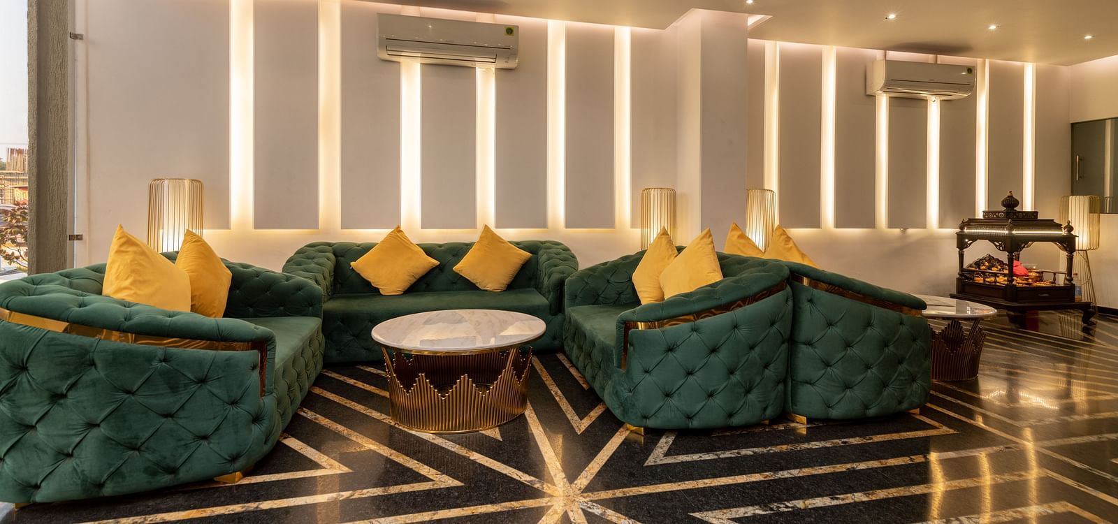 The waiting area near the reception with sofa sets and coffee table - DLS Ganga Bliss, Haridwar