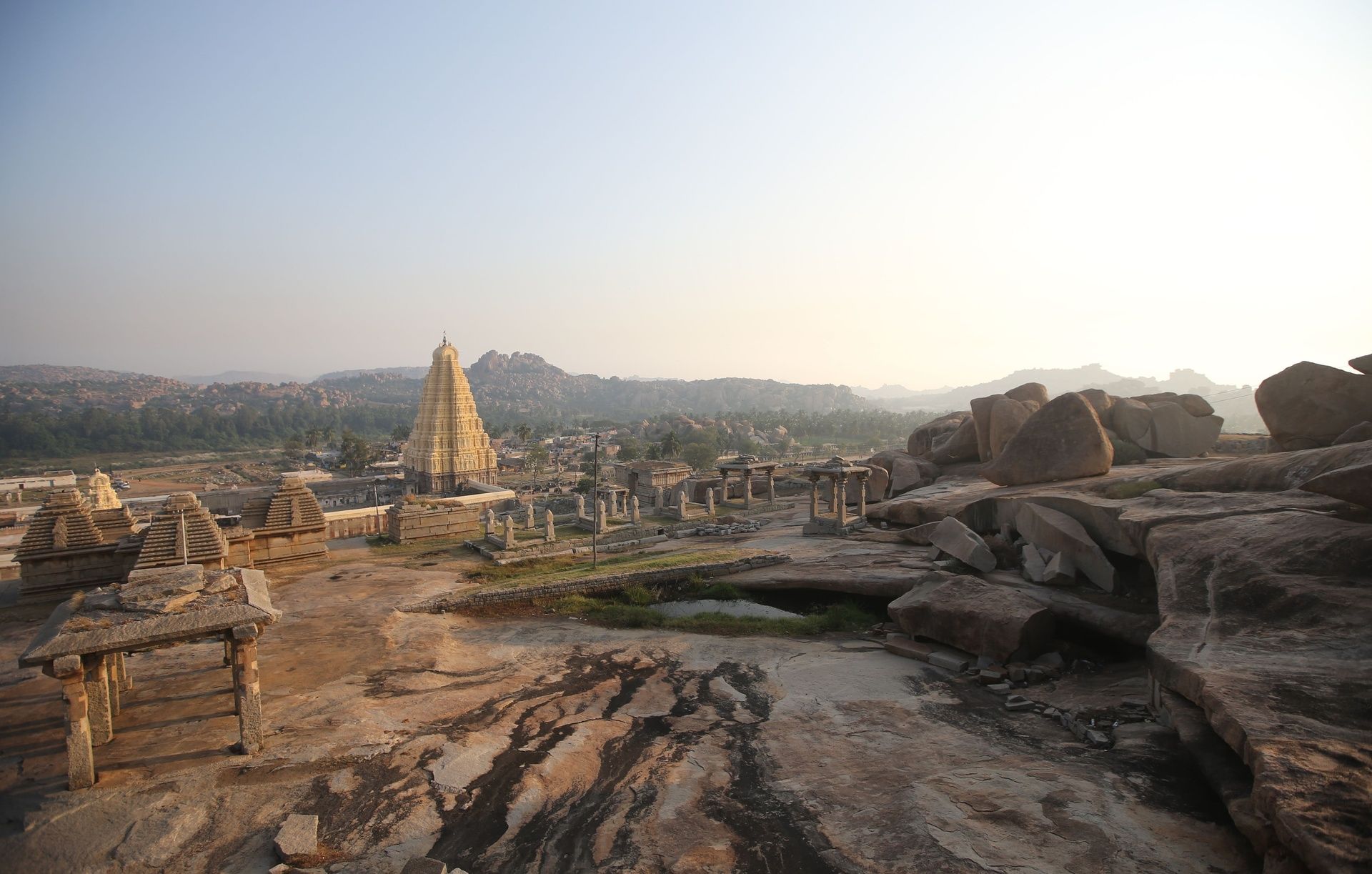 Virupaksha temple complex in Hampi with rocky landscape.