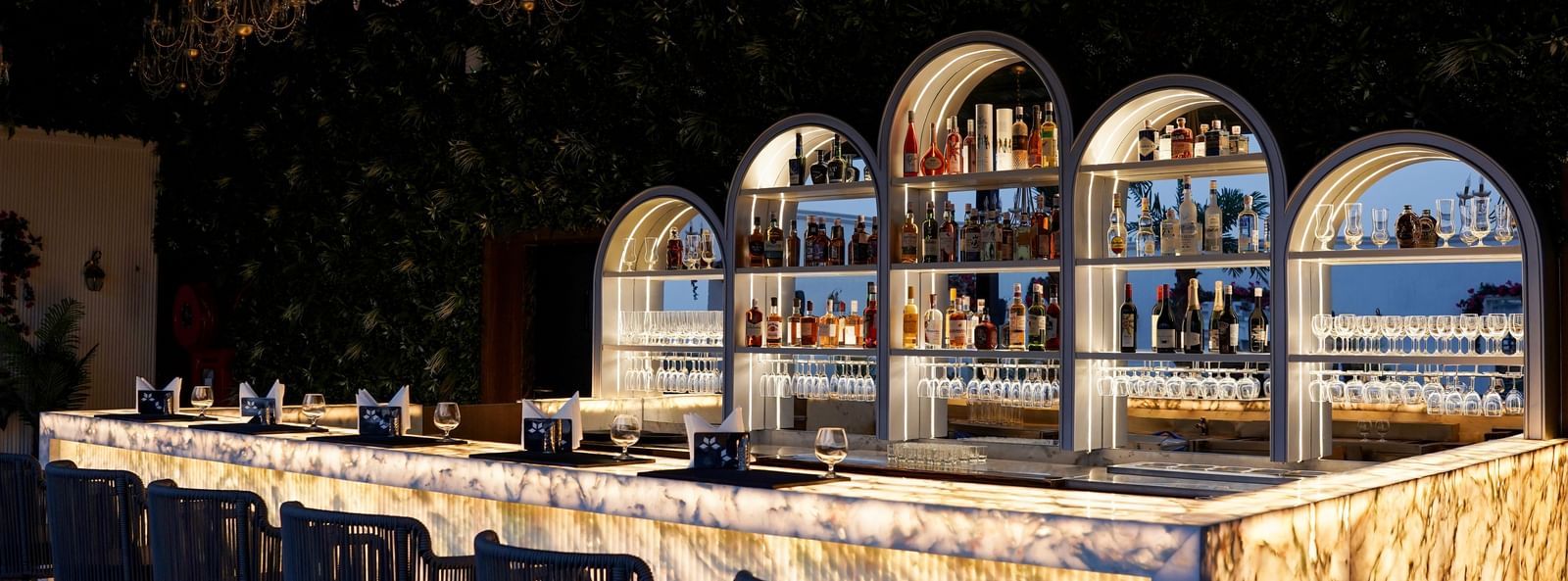 Corner view shot of the bar counter featuring an extensive collection of premium liquor for display at the Sky Roof at M2 Square by Monday Premium.