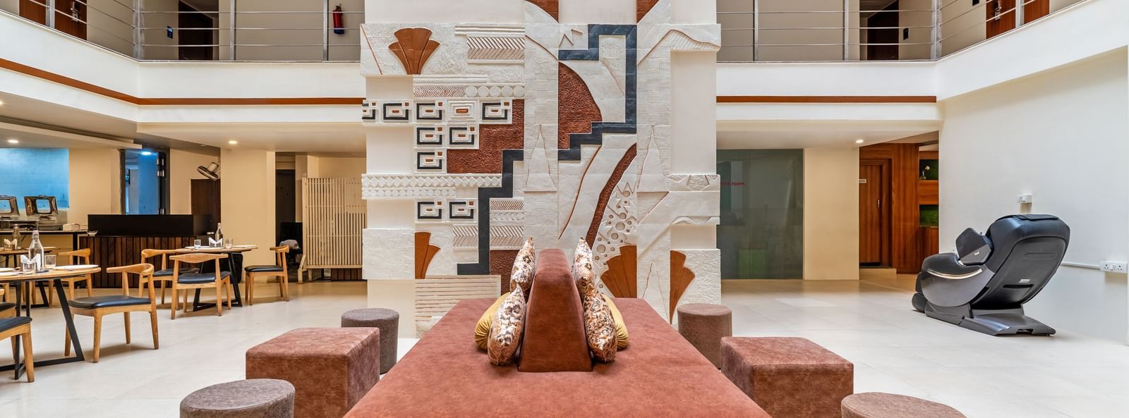 A spacious hotel lobby with seating arrangements and decorative elements - Monday Hotels HITEC City, Hyderabad