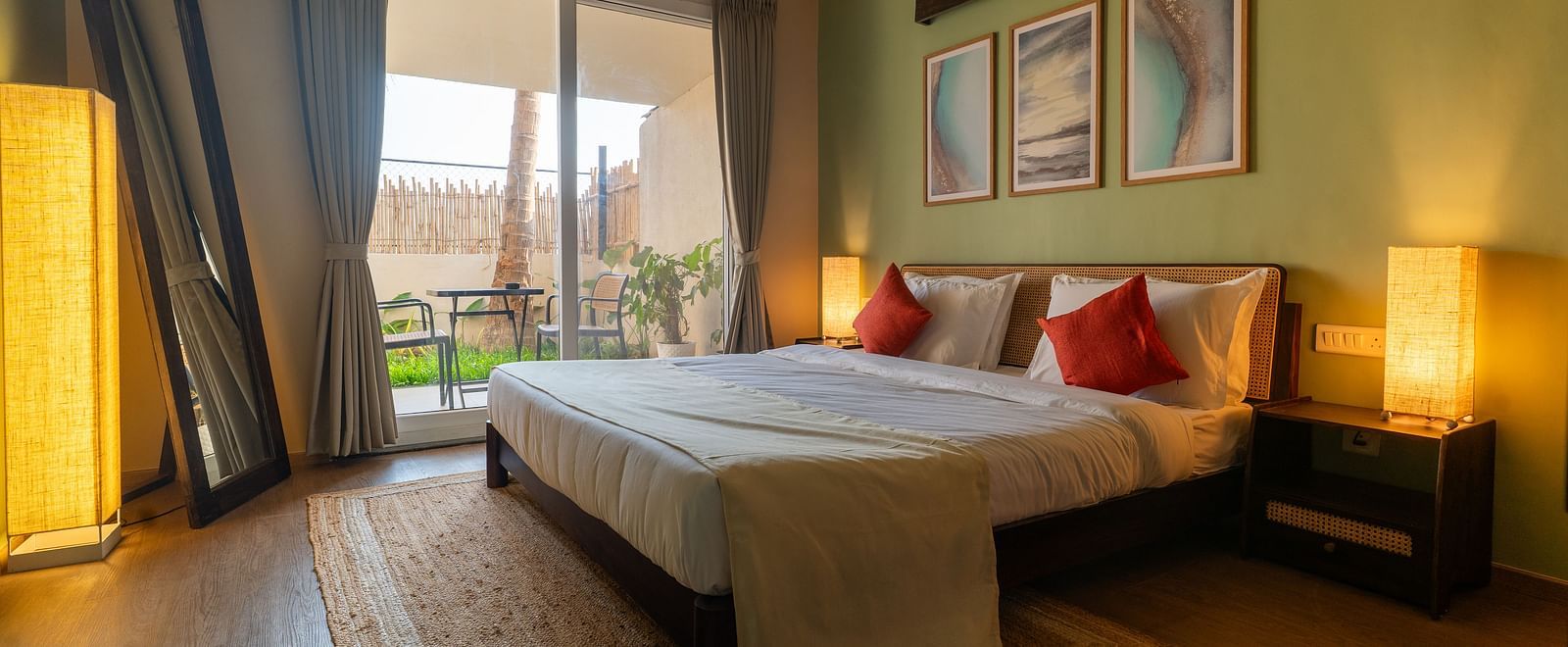 Bright and airy bedroom with double bed, contemporary decor, and access to balcony at Kssemya.