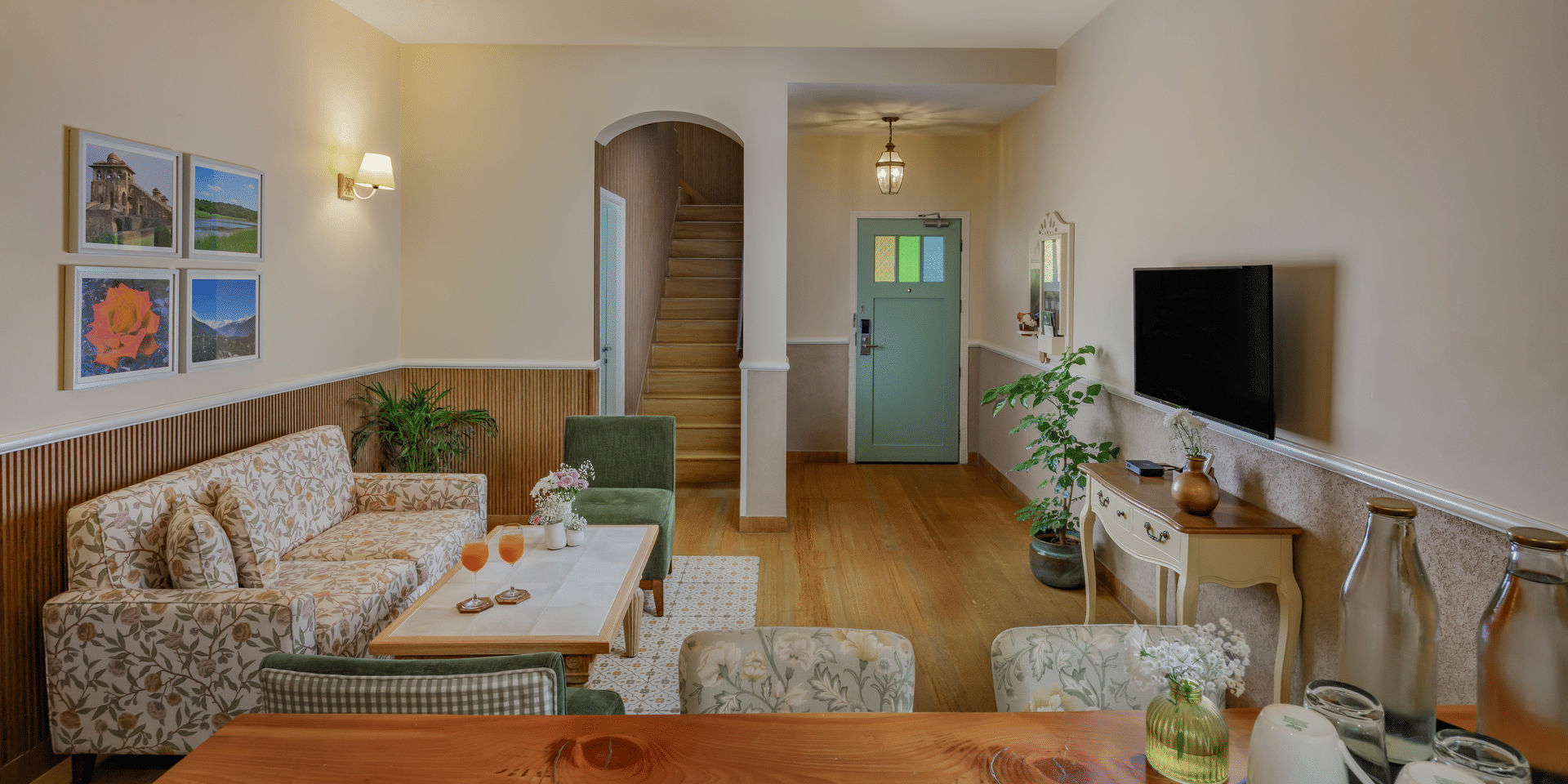 An inclusive view of Eagle's Perch showcasing the mellow interiors, curated items placed on tables and chairs | Karma Chalets