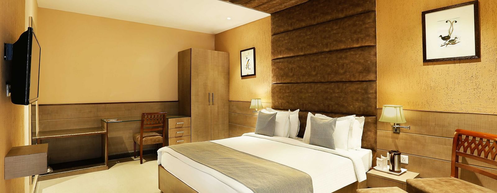 Hotel room featuring a cozy bed and stylish interior design.