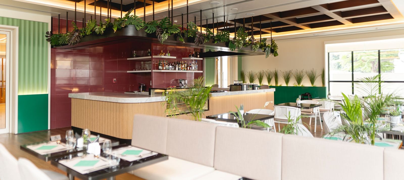 Meli-Melo Restaurant at KertelSuites, featuring elegant seating arrangements and stylish ceiling lights