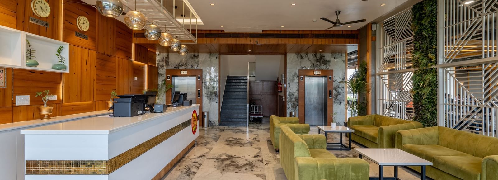 Modern reception and lounge area at Hotel Highway King, Bagru, featuring stylish seating and contemporary decor.