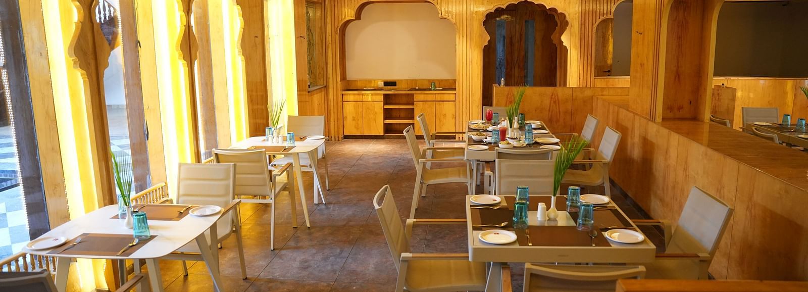 a wooden themed restaurant seating arrangements at Lords Hrim Resort Basar 