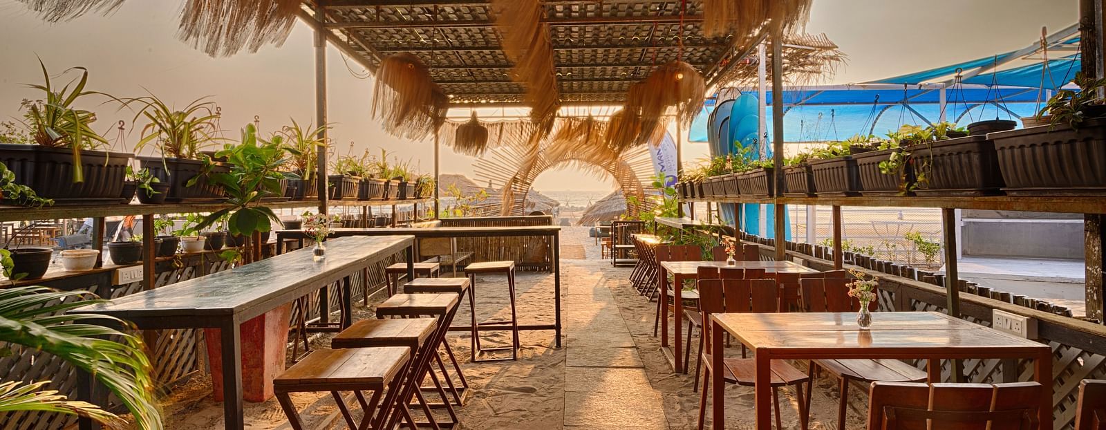 Open-air dining area with rustic beach decor at Royale Amata by the Beach Restaurant