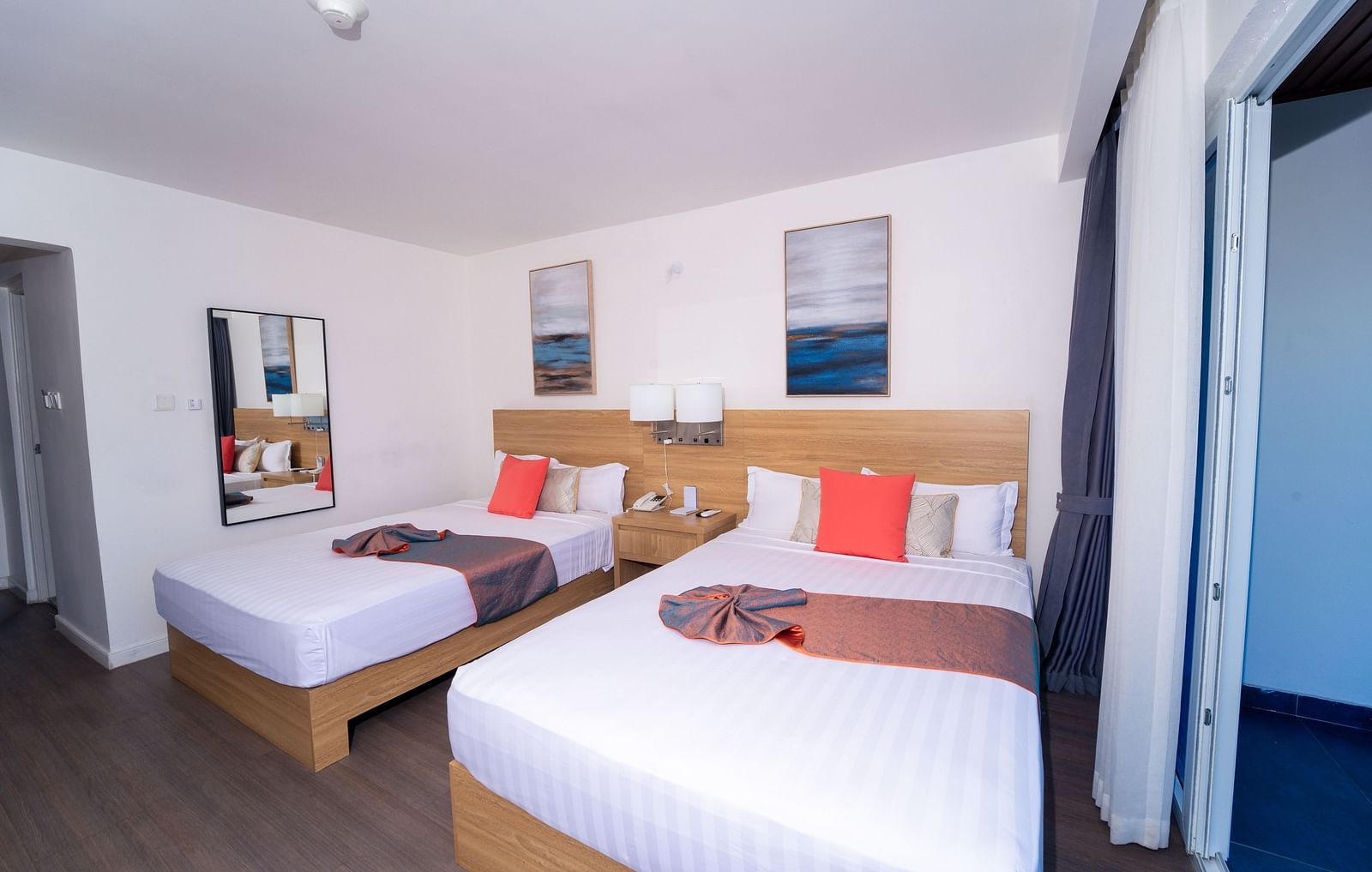 An image of a Montego Bay hotel room with double beds and a balcony - Hotel 39, Jamaica (Montego Bay)