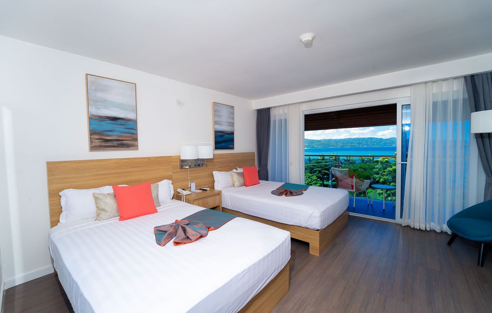 An image of a hotel room in Montego Bay with a balcony that offers the view of the shore - Hotel 39, Jamaica (Montego Bay)