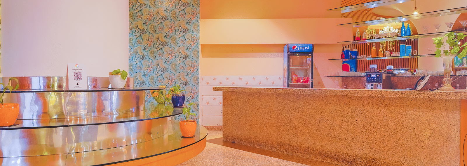 A modern cafe counter area with displays and a clean, inviting design at The Conway, Meerut.