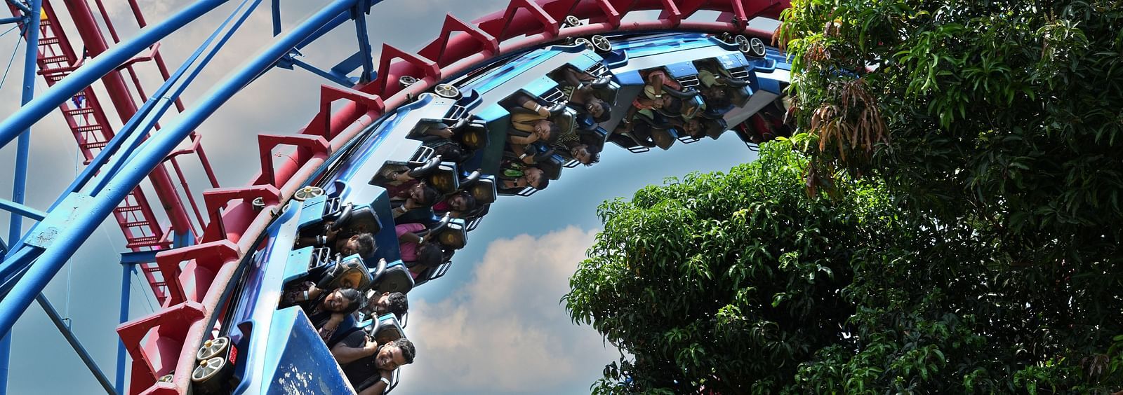 People on a roller coaster amusement park ride