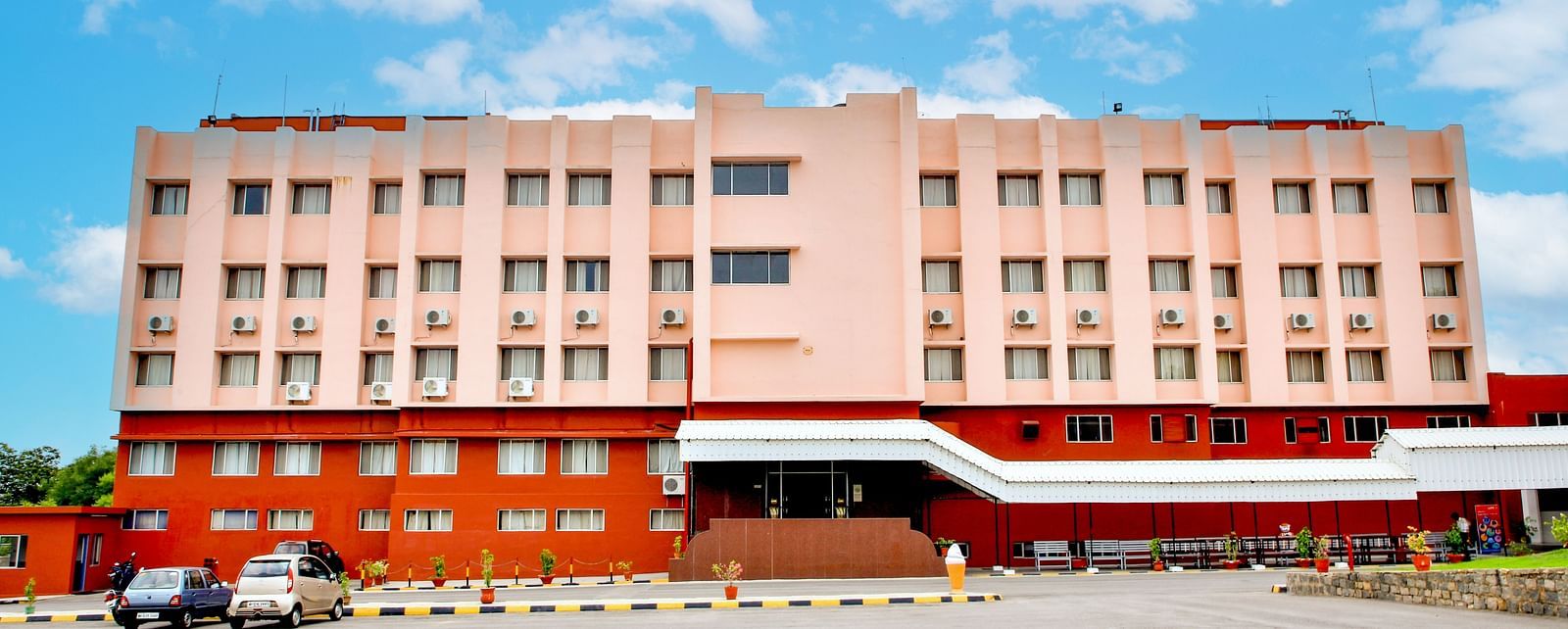 A long shot of the facade of Hotel Sahara in Ramoji Film City - Scenic Hotel Exterior in Hyderabad.