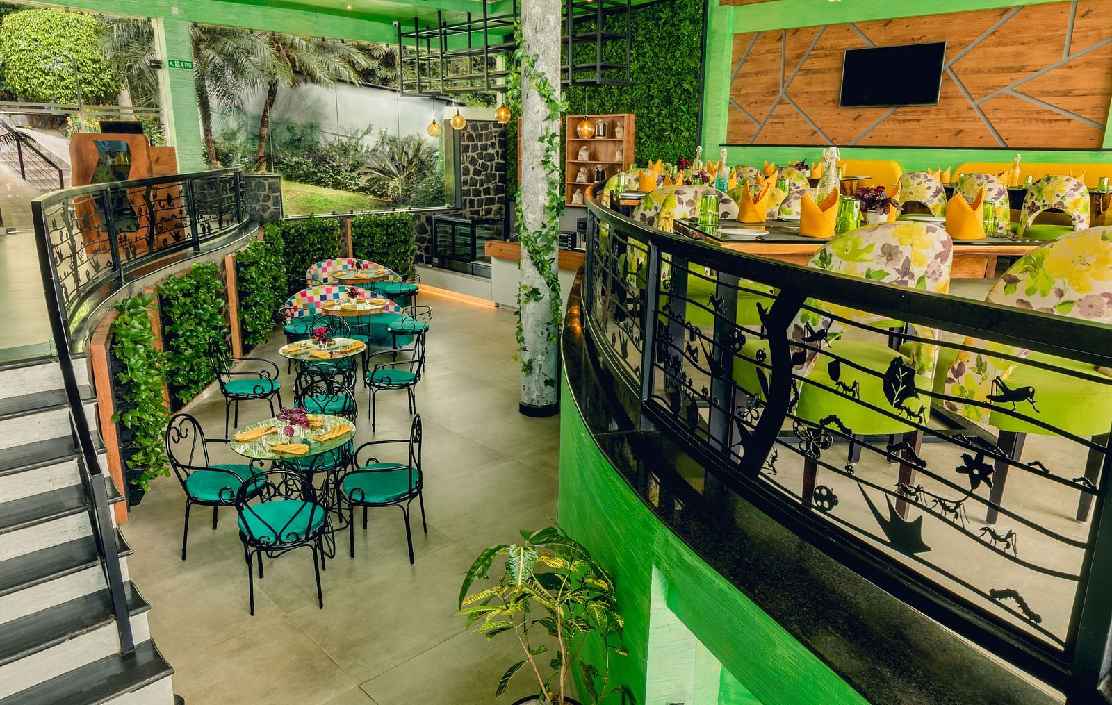 An image of a restaurant with seating arrangement at Great Trails Yercaud by GRT Hotels