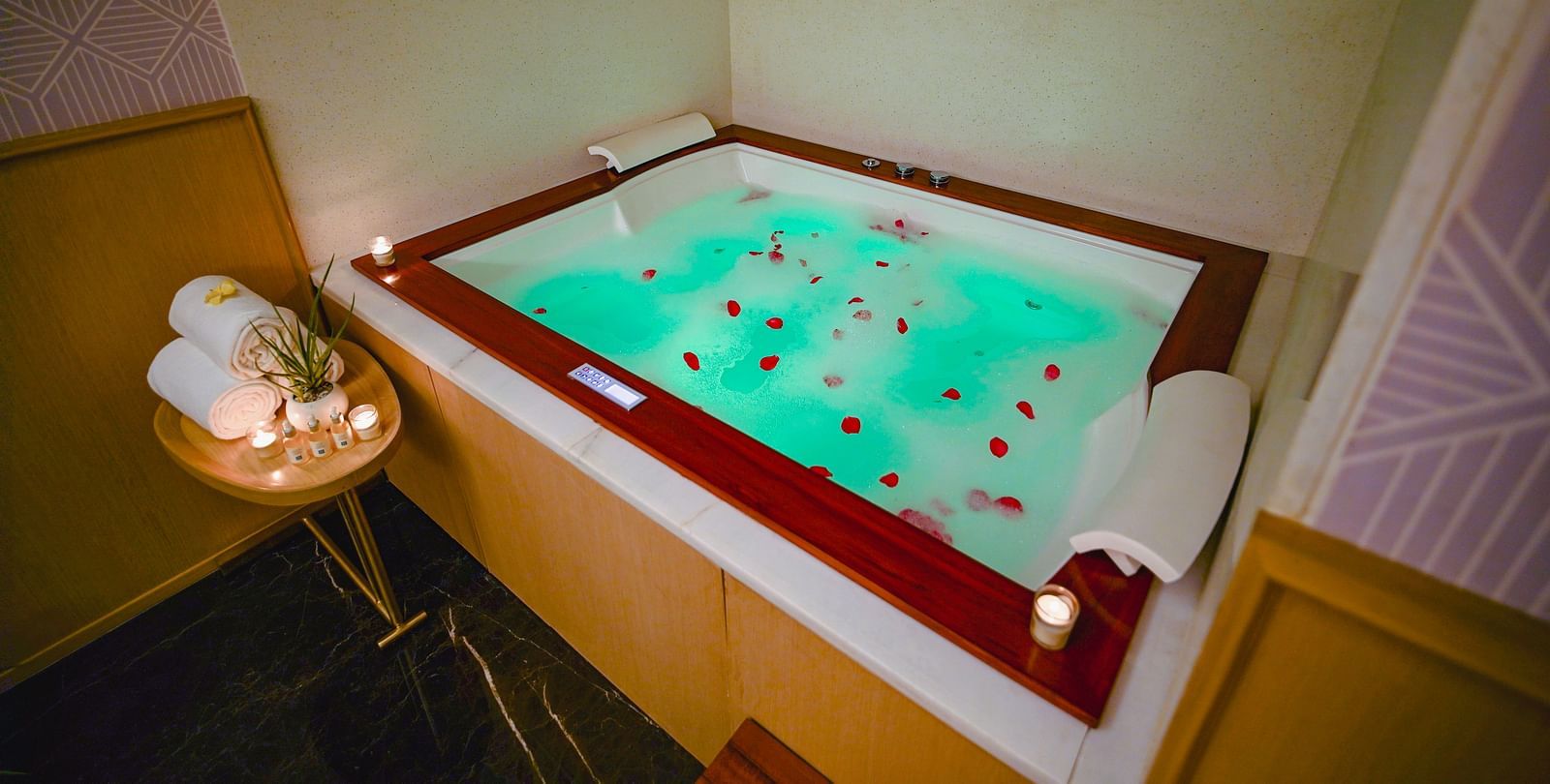 A jacuzzi in our Madhurai spa with flower petals in the water - Grand Madurai by GRT Hotels