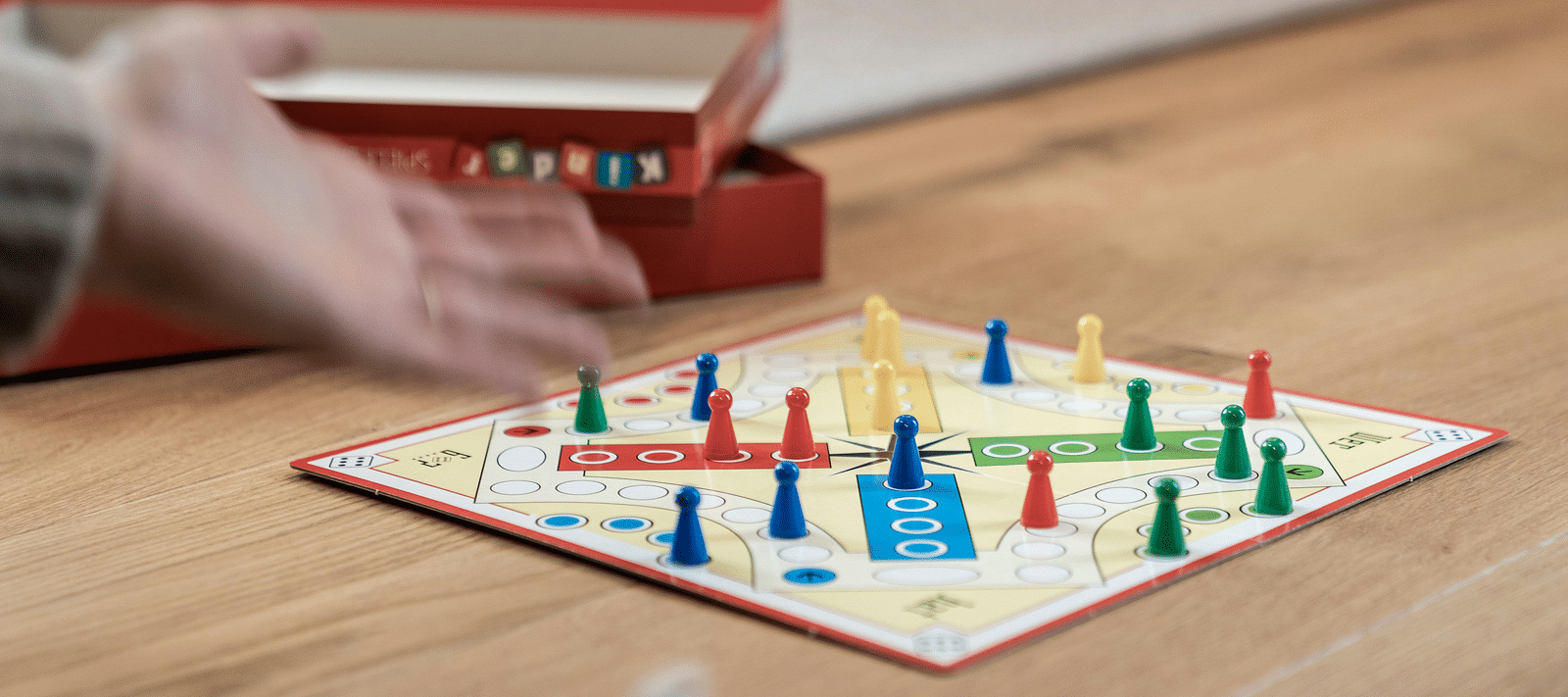 A close up shot of a game of ludo