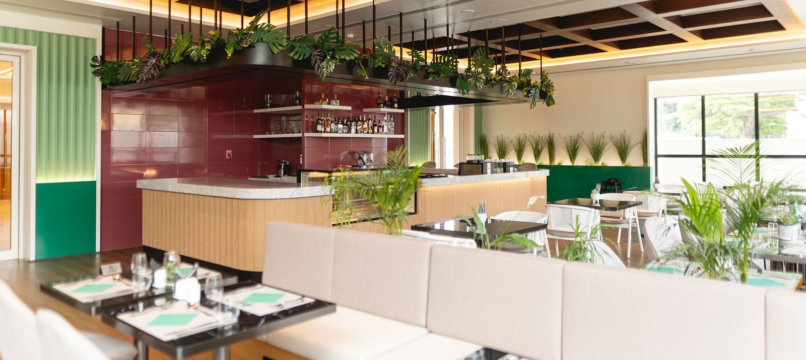 Meli-Melo Restaurant at KertelSuites, featuring elegant seating arrangements and stylish ceiling lights