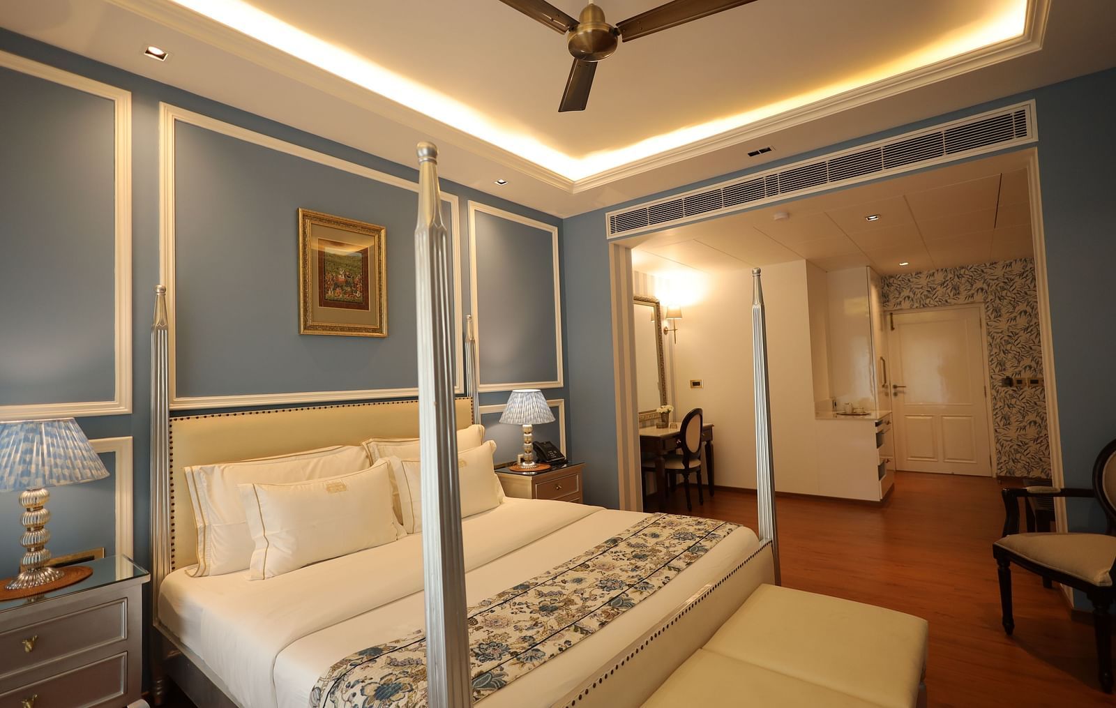 A room at Dileep Kothi, Jaipur with a double bed and blue walls