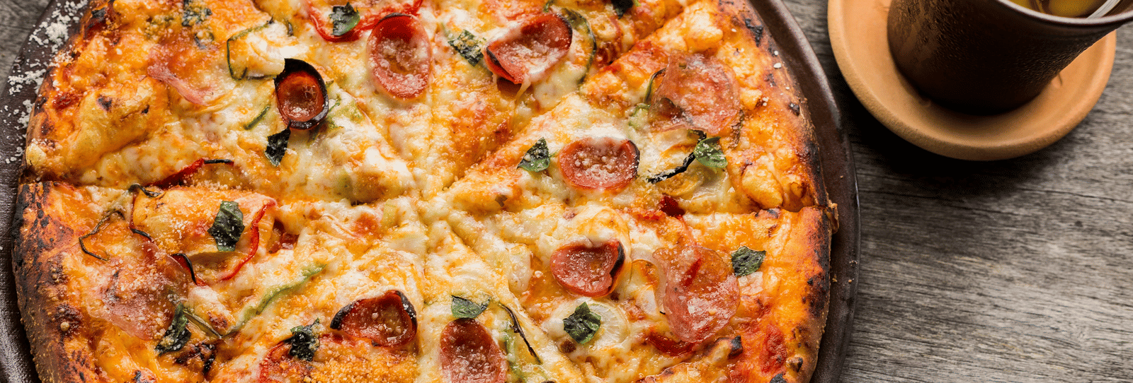 Freshly baked pizza served with a hot beverage at Accord Chrome Airport Hotel.