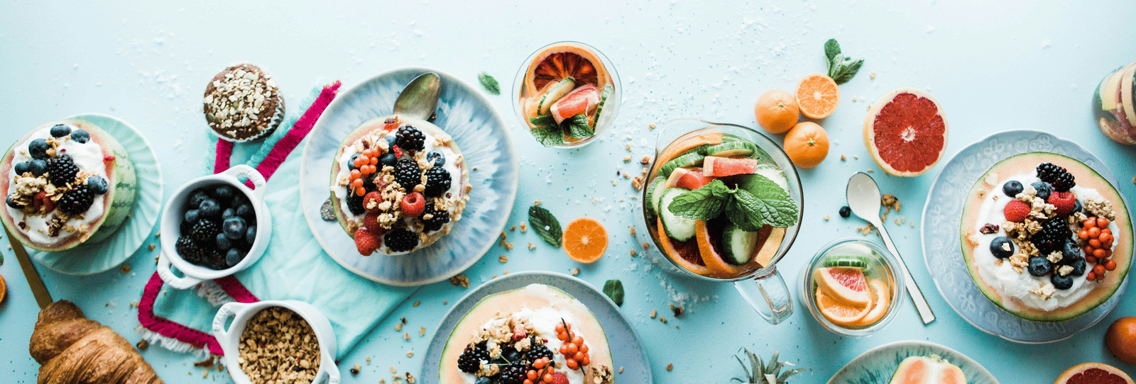 Colorful breakfast spread with fresh fruits, pancakes, and croissants served at Accord hotels and resorts,