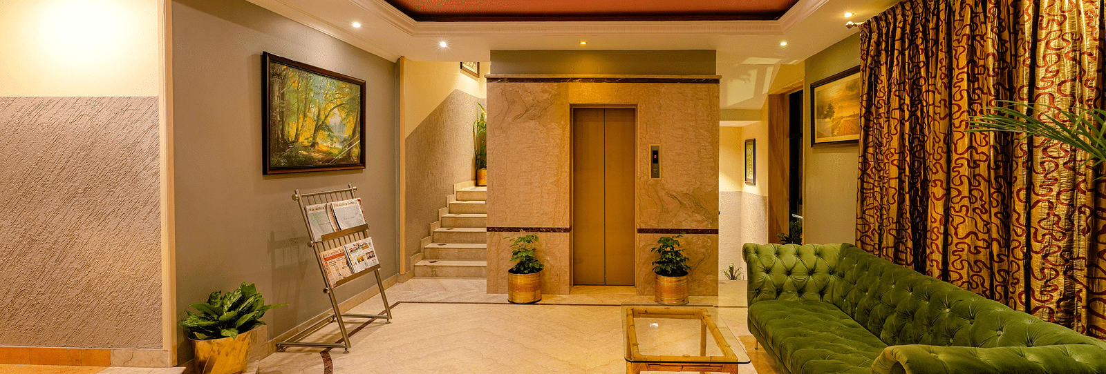 A welcoming reception area with soft lighting and elegant decor - Cross Roads Inn, Bengaluru