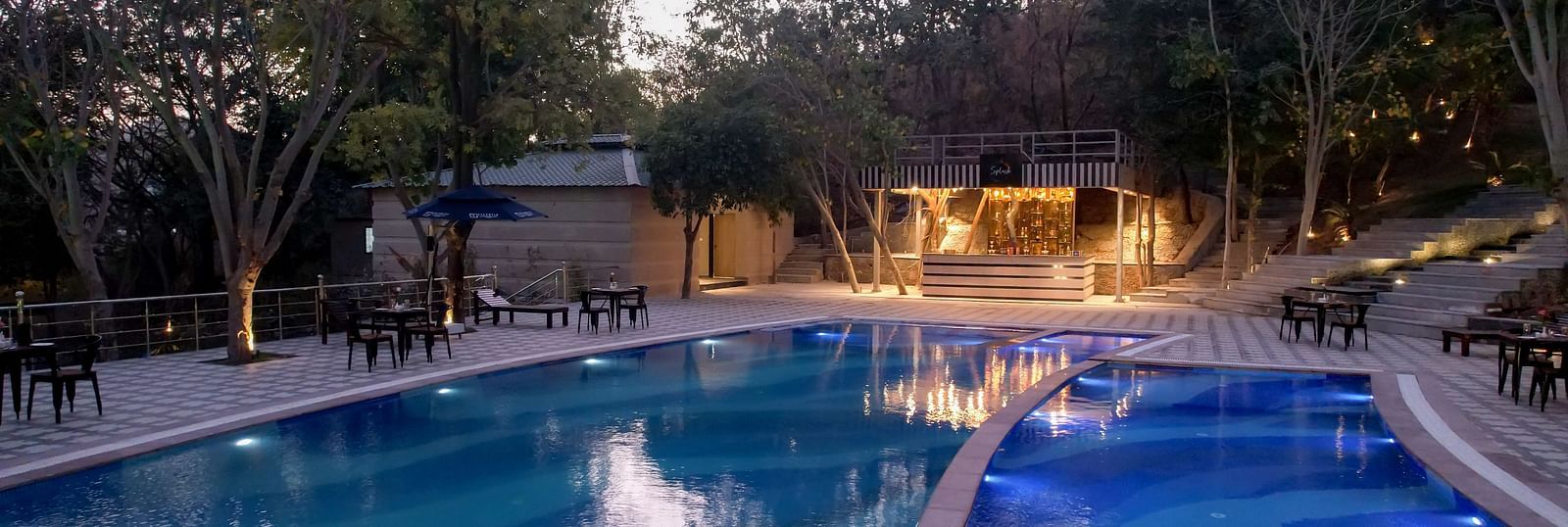 A view of the swimming pool at Essentia Luxury Resort & Spa, Udaipur.