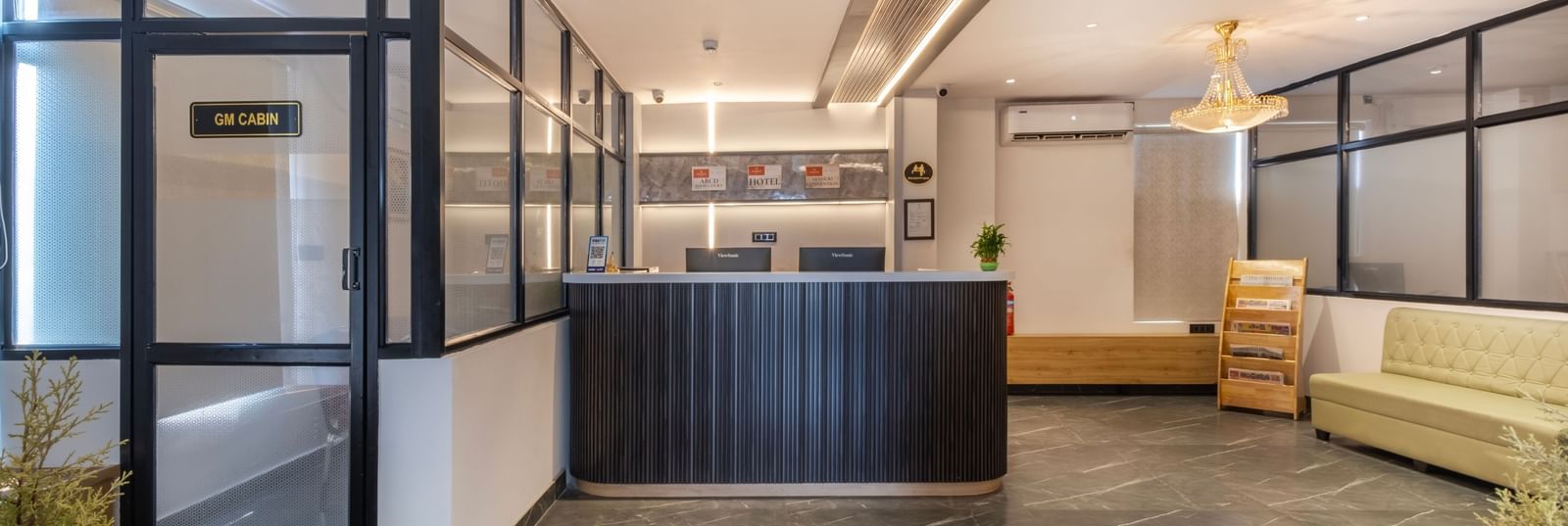 Lobby at Monday Hotels Amalapuram Heights with reception desk and lounge area.