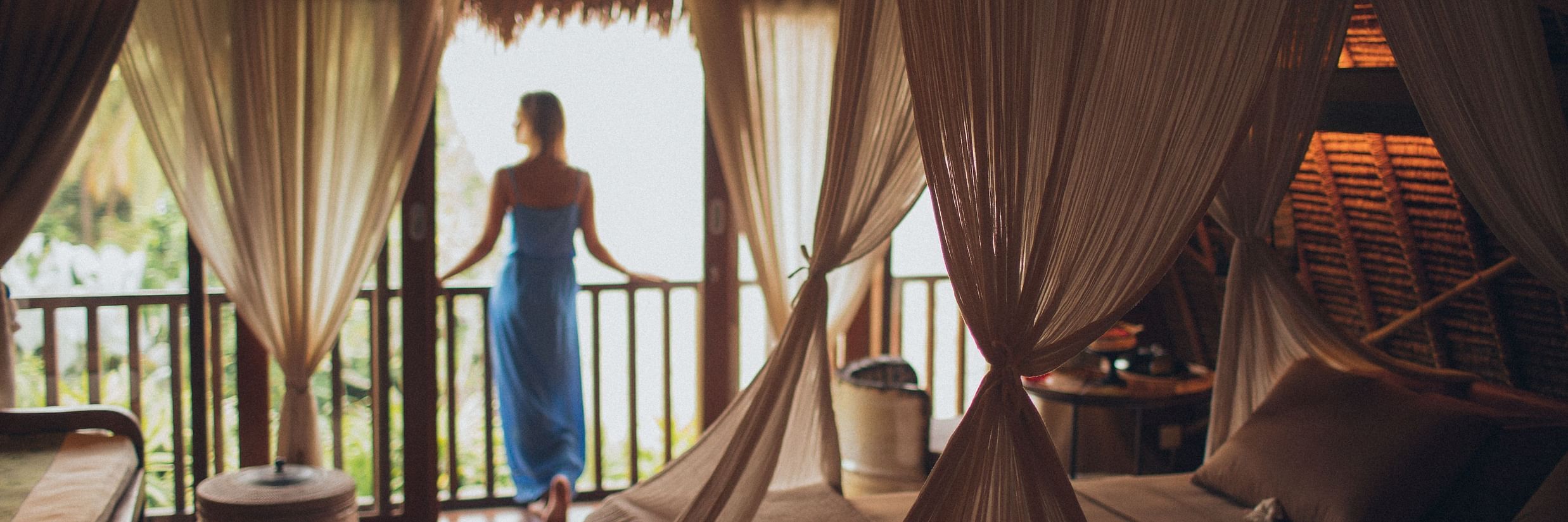 woman looking outside the balcony