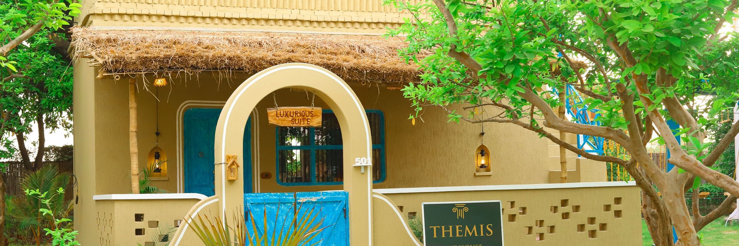 Facade of a pool villa at Themis Mudhouse, a nature resort near Delhi