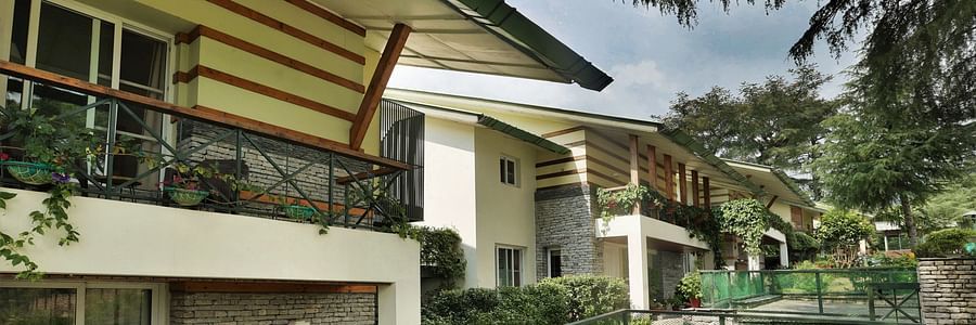Exterior view of parking area and entrance to villas at lamrin norwood green captured during the day2
