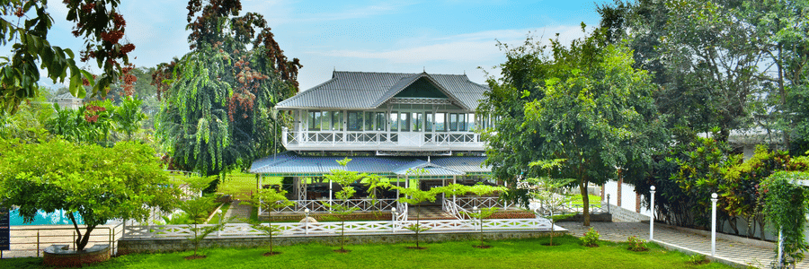 picture of a Huge building with a lawn in the front captured in  the day time