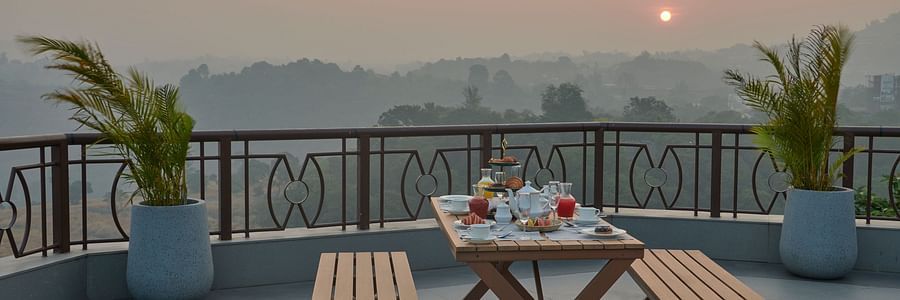 Sunrise breakfast at Sky Deck with panoramic views and seating arrangements at The Dukes Retreat