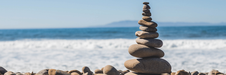 pebbles stacked on top of each other on the beach
