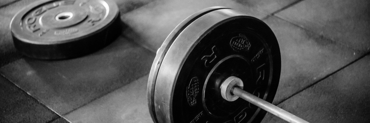a weightlift laying on the floor at a gym