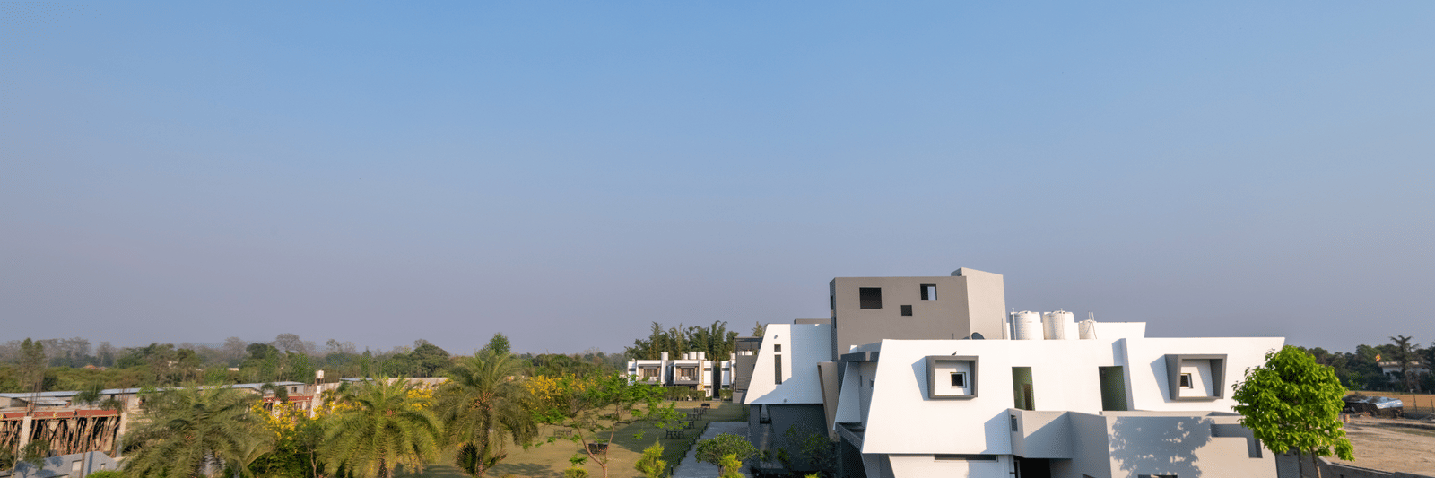 Swimming pool with sun loungers and scenic views - DLS Forest Vines Resort & Spa, Ramnagar (Jim Corbett)