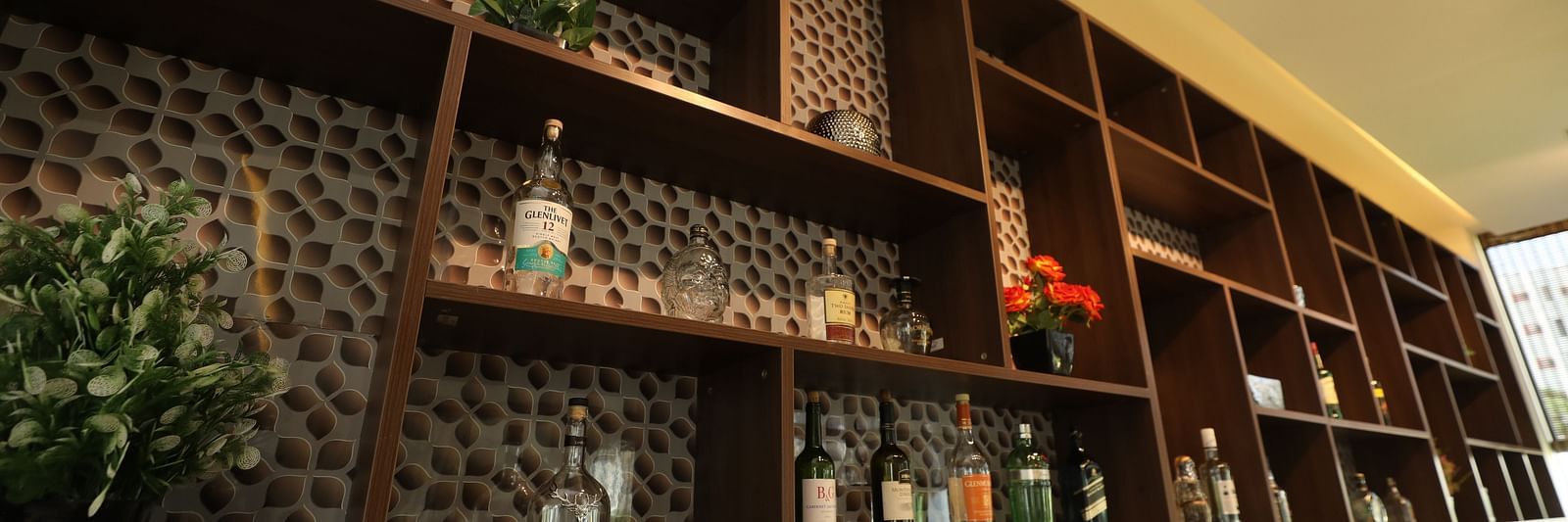 Well-stocked bar shelf - Welcome Inn Hotels