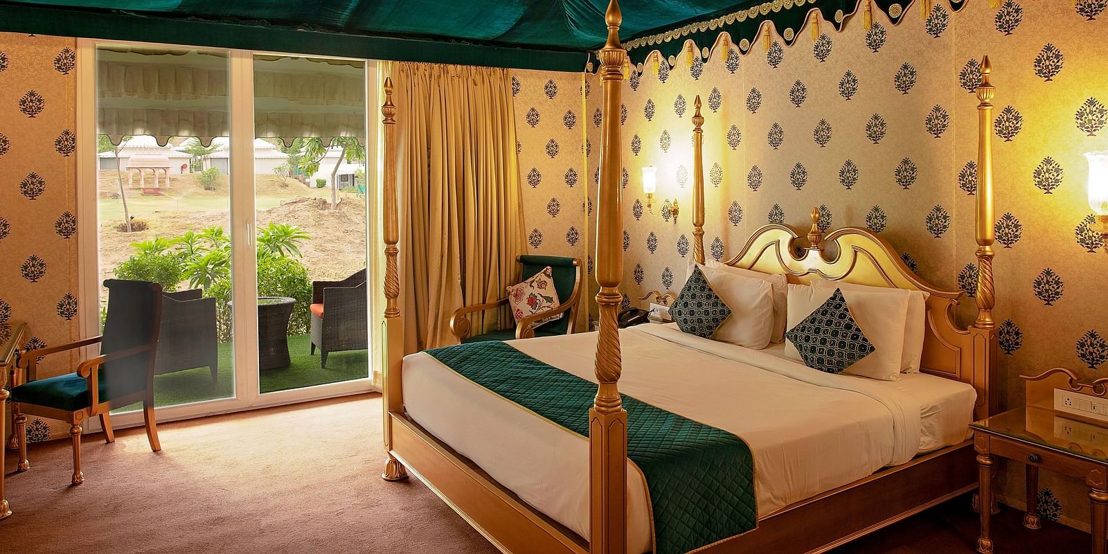 Image of Royal Luxury Tent a bed and an attached balcony on the side at Rajasthali Resort & Spa Jaipur.