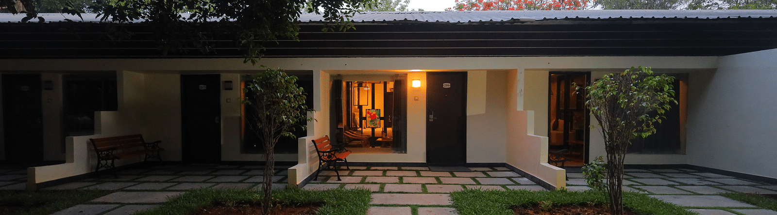 An image of property amidst trees and plants - Sathyam Grand Resort
