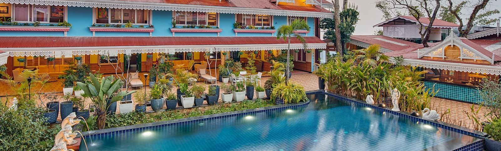 the swimming pool of the resort - seating spaces at the lawn - Mayfair Himalayan Spa Resort Kalimpong