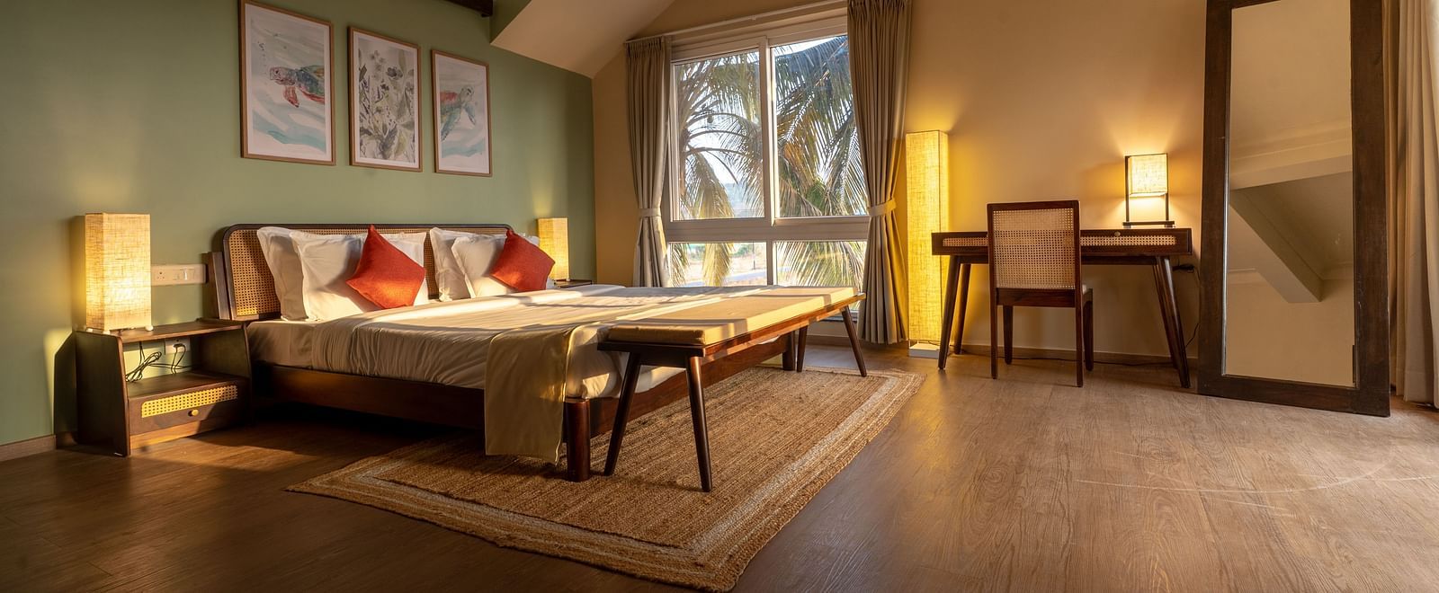 Spacious bedroom with cosy lighting, artwork, and natural wooden elements at Kssemya.
