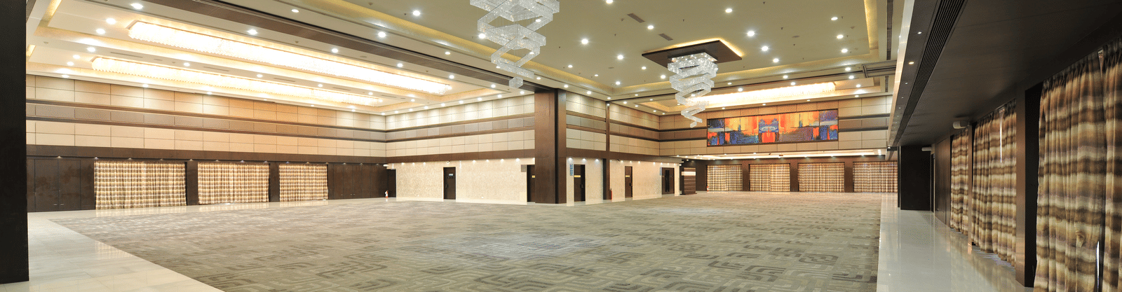 Spacious conference hall with grand ceiling and stylish interiors – Narayani Heights Hotel & Resorts