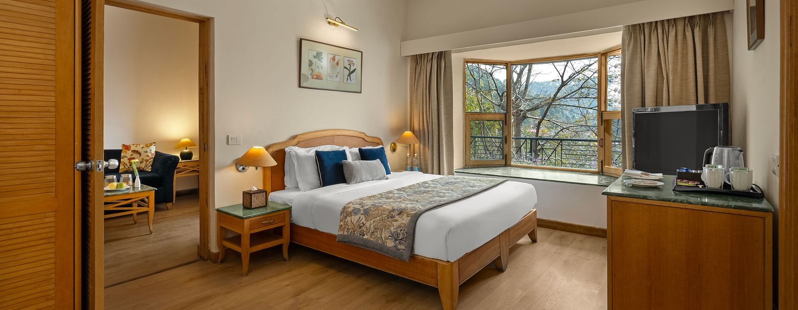 Superior Cottage Hill View with comfy bed, Tv, and window with a beautiful view at Baikuth resort, kasauli.