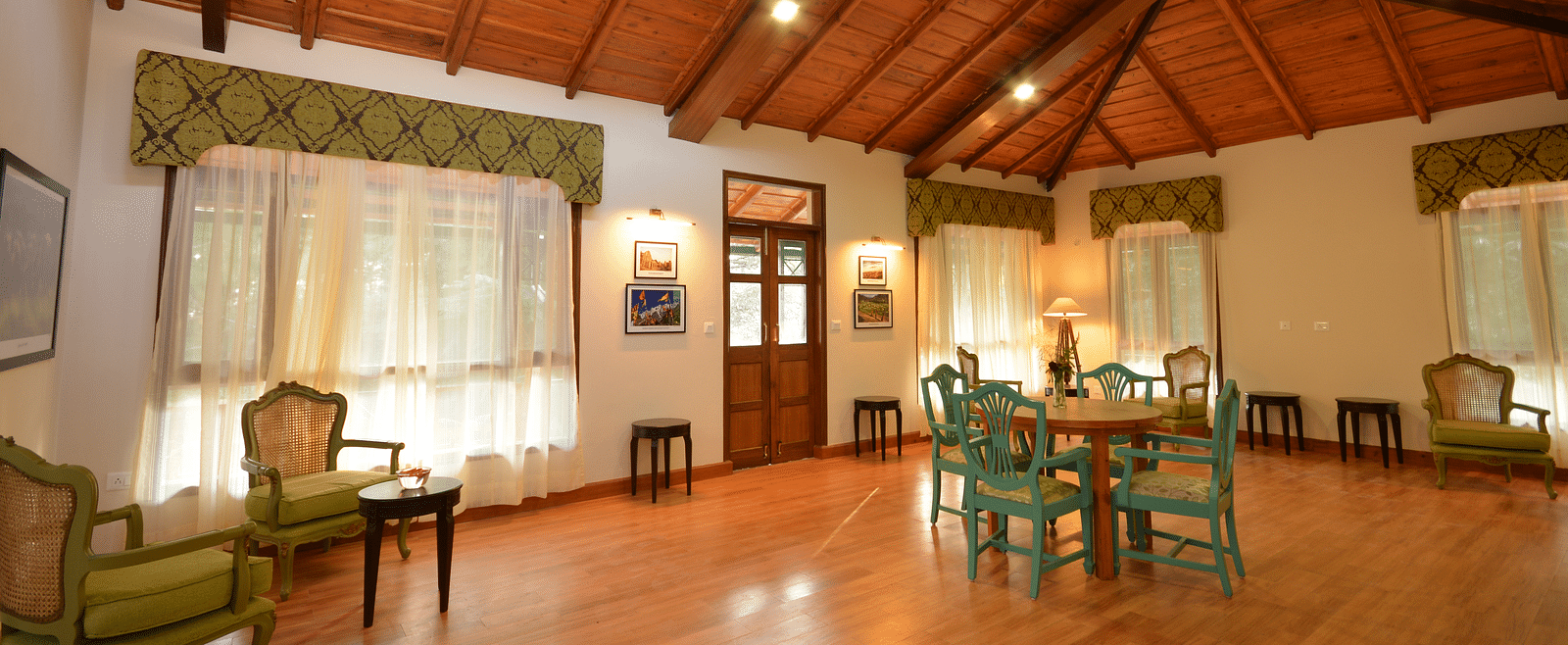 A spacious conference room in Almora with elegant wooden interiors and comfortable seating - BluSalzz Escapade - Anant Rasa Resort