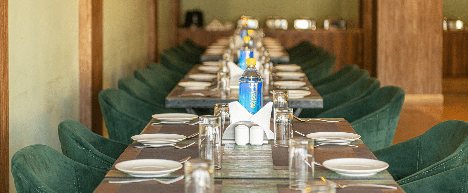 A shot of the restaurant with chairs and tables laid out with cutlery - DLS Ganga Bliss, Haridwar