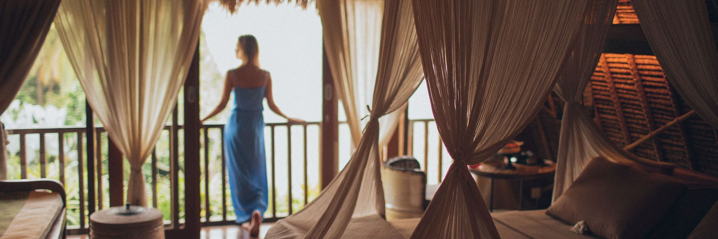 woman looking outside the balcony