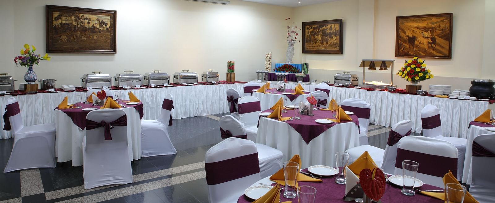Lagan Hall decked with tables and chairs at Tara, Comfort Hotel in Hyderabad - Ramoji Film City.