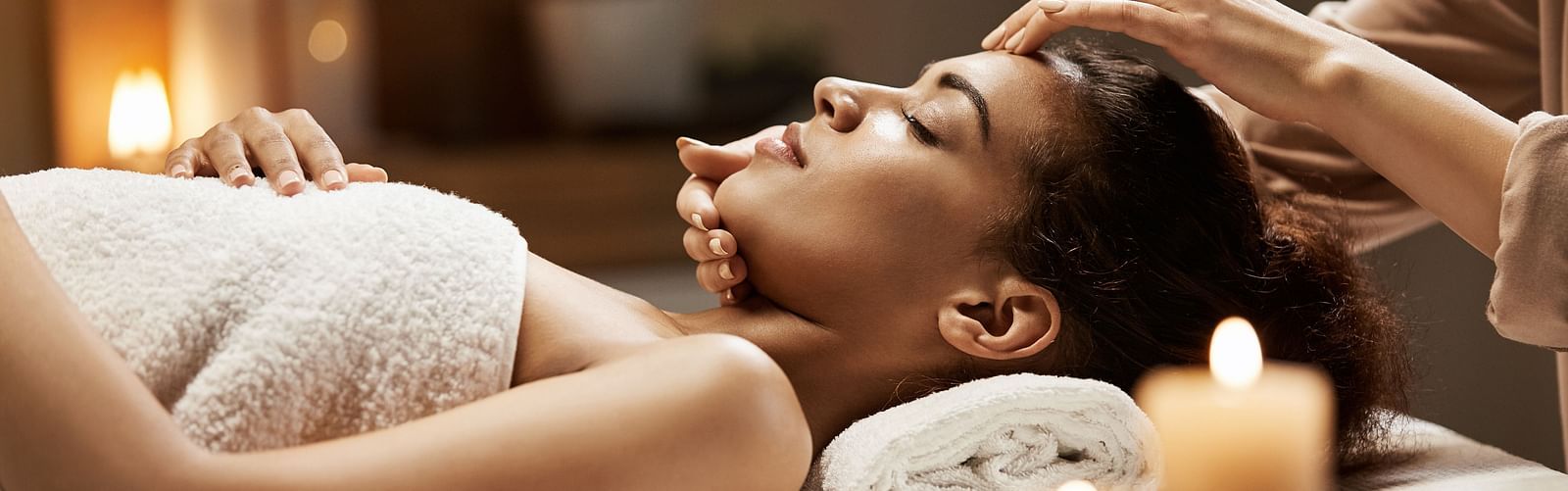 image of a woman recieving a relaxing and rejuvenating spa from a  masseuse 